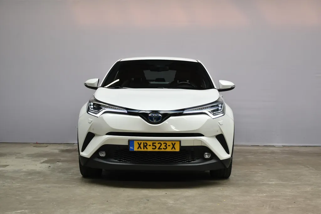 Toyota C-HR 1.8 Hybrid 122pk CVT Bi-Tone Navigatie | Cruise | Clima | PDC |Half Leer | Parlemoer Wit