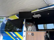 Renault Master T35 2.3 dCi 135 L3H2 Work Edition | Camper Edition | Motorsport Edition | Thule Omnistor Luifel | Airco in Leefruimte | TV | Koelkast | Magnetron | Volledig Bed | 2 Lederen Stoelen | DAB | LED Verlichting Leefruimte |