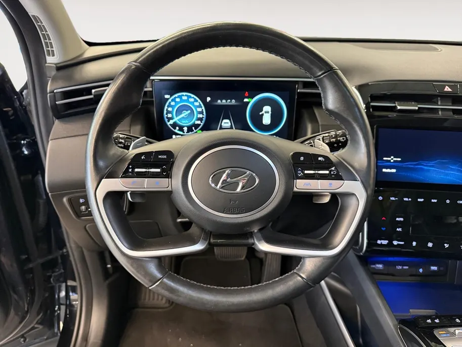 Hyundai Tucson 1.6 T-GDI PHEV Premium Sky 4WD | 66km WLTP elektrisch | Navigatie | Adaptive cruise control | Trekhaak | Apple Carplay & Android Auto | Dode hoek detectie | Draadloze telefoonlader |