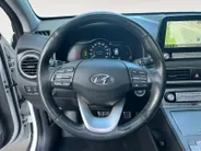 Hyundai Kona EV Fashion 64 kWh 204PK | Warmtepomp | Navigatie | Apple Carplay & Android Auto | Adaptive cruise control | Open dak | Head-up display | Achteruitrijcamera |