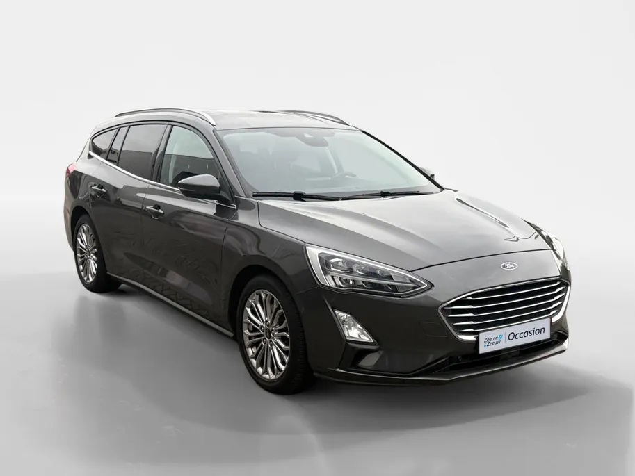 Ford Focus Wagon 1.0 EcoBoost Titanium Business | Trekhaak | HUD | Achteruitrijcamera | Winter Pack | Dodehoek detectie | Elektr. Achterklep | 12 maanden garantie! |