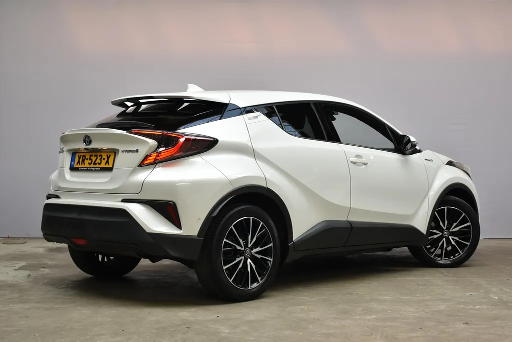 Toyota C-HR 1.8 Hybrid 122pk CVT Bi-Tone Navigatie | Cruise | Clima | PDC |Half Leer | Parlemoer Wit