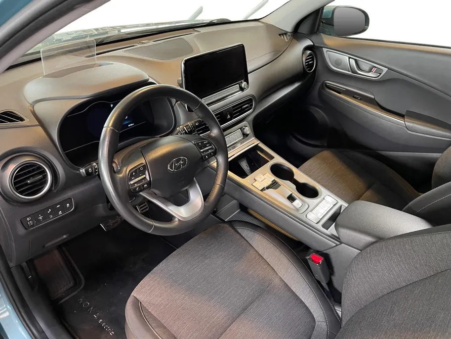 Hyundai Kona EV Fashion 64 kWh 204PK | Warmtepomp | Navigatie | Apple Carplay & Android Auto | 100% SOH | Adaptive cruise control | Climate control | Head-up display | Parkeersensoren achter |