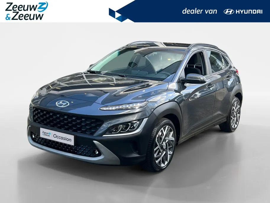 Hyundai Kona 1.6 GDI HEV Fashion Design Sky 105PK | 1ste eigenaar | Navigatie | Apple Carplay & Android Auto | Adaptive cruise control | Trekhaak | Schuif- kanteldak | Parkeersensoren achter | Stoelverwarming voor |