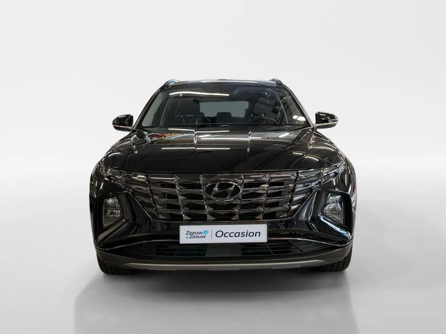 Hyundai Tucson 1.6 T-GDI PHEV Premium Sky 4WD | 66km WLTP elektrisch | Navigatie | Adaptive cruise control | Trekhaak | Apple Carplay & Android Auto | Dode hoek detectie | Draadloze telefoonlader |