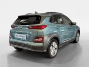 Hyundai Kona EV Fashion 64 kWh 204PK | Warmtepomp | Navigatie | Apple Carplay & Android Auto | 100% SOH | Adaptive cruise control | Climate control | Head-up display | Parkeersensoren achter |