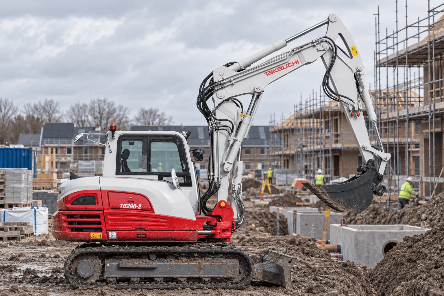 takeuchi tb290-2 two piece boom aan het werk in een nieuwbouwwijk