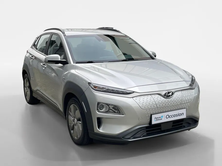 Hyundai Kona EV Comfort 64 kWh | Warmtepomp | 100% SOH | Adaptive cruise control | Apple Carplay & Android Auto | Achteruitrijcamera | Parkeersensoren achter | Keyless entry | DAB radio |