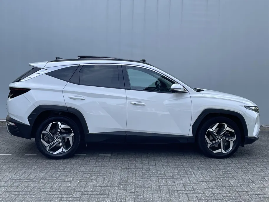 Hyundai Tucson 1.6 T-GDi HEV 230pk Aut. Premium Sky / Navigate + Camera / Schuif-kanteldak / Full Option! /