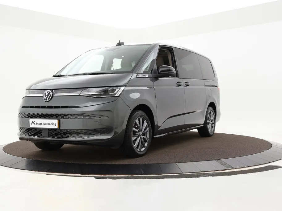 Volkswagen Multivan 1.4 218pk DSG eHybrid L2H1 Life Business · Glazen dak · Trekhaak · Camera · Elek. Schuifdeuren · Apple/Android Car Play · 7 Persoons · 18'' Inch · Garantie t/m 02-06-2028 of 100.000km