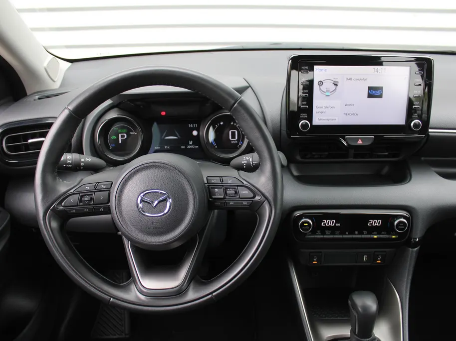 Mazda 2 Hybrid 1.5 Agile | Comfort pakket | Trekhaak | CarPlay | Camera | Stuur-/stoelverwarming | Cruise adapt. | 15' LM |