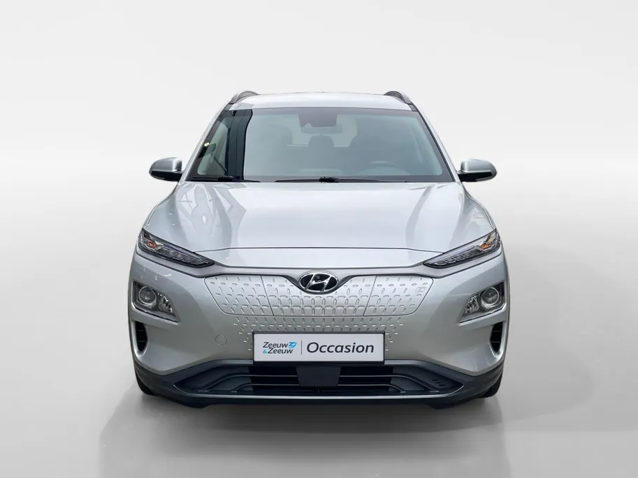 Hyundai Kona EV Comfort 64 kWh | Warmtepomp | 100% SOH | Adaptive cruise control | Apple Carplay & Android Auto | Achteruitrijcamera | Parkeersensoren achter | Keyless entry | DAB radio |