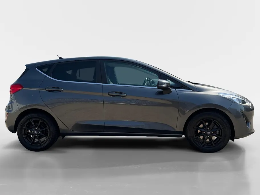 Ford Fiesta 1.0 EcoBoost Titanium | Dealer onderhouden | Winter pack | Parkeersensor achter | Apple carplay & Android auto | Navigatie via carplay | Cruise control | Elektr. inklapbare buitenspiegel | Privacy glas |
