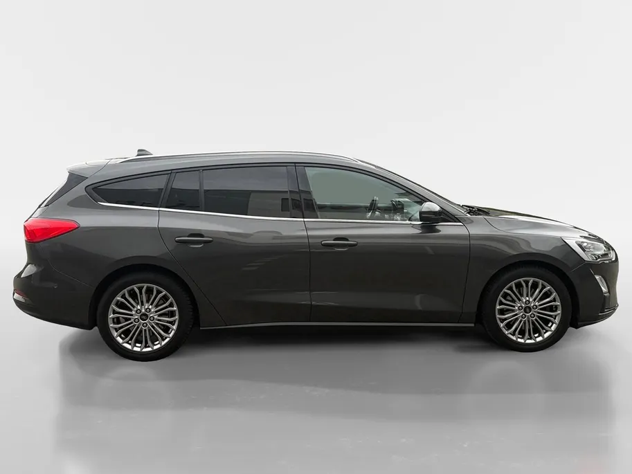 Ford Focus Wagon 1.0 EcoBoost Titanium Business | Trekhaak | HUD | Achteruitrijcamera | Winter Pack | Dodehoek detectie | Elektr. Achterklep | 12 maanden garantie! |