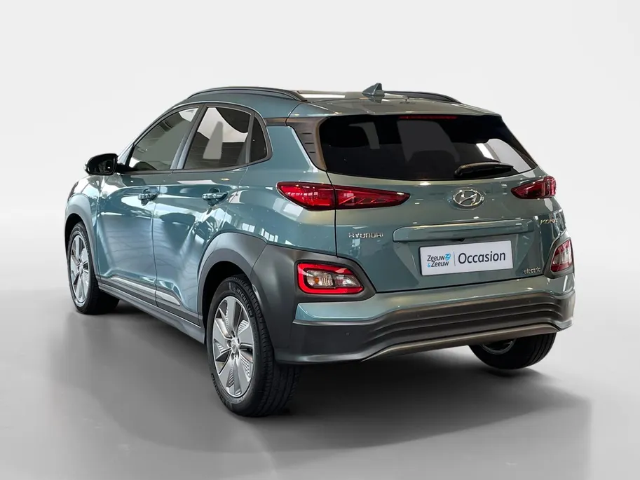 Hyundai Kona EV Fashion 64 kWh 204PK | Warmtepomp | Navigatie | Apple Carplay & Android Auto | 100% SOH | Adaptive cruise control | Climate control | Head-up display | Parkeersensoren achter |