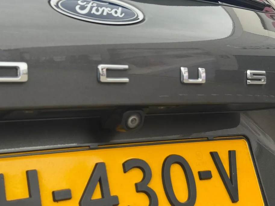 Ford Focus Wagon 1.0 EcoBoost Titanium Business | Trekhaak | HUD | Achteruitrijcamera | Winter Pack | Dodehoek detectie | Elektr. Achterklep | 12 maanden garantie! |