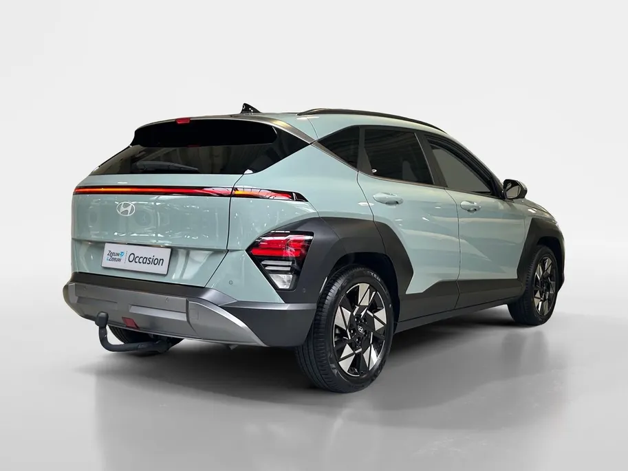 Hyundai Kona 1.6 GDI HEV Premium | Trekhaak Afn 13polig| Apple Carplay / Android Auto | Navigatiesysteem | Elektrisch Verstelbare Voorstoelen | Bestuurdersstoel + Geheugen | Parkeersensoren Voor + Achter | Camera Voor + Achter | Stoelverwarming + Stoelkoeling | Stuurv