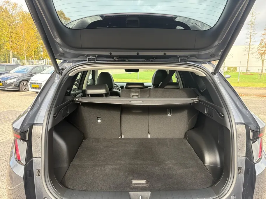 Hyundai Tucson 1.6 T-GDI HEV Premium Sky | Full options! | Elek. stoelverstelling | Schuif- kanteldak | Leder | Stoelverwarming en koeling
