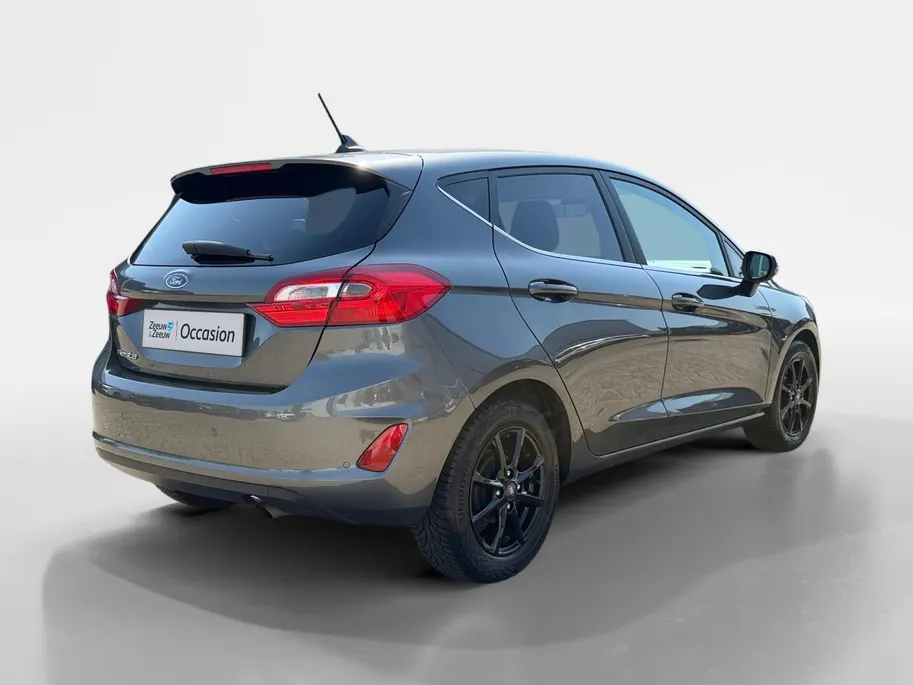 Ford Fiesta 1.0 EcoBoost Titanium | Dealer onderhouden | Winter pack | Parkeersensor achter | Apple carplay & Android auto | Navigatie via carplay | Cruise control | Elektr. inklapbare buitenspiegel | Privacy glas |