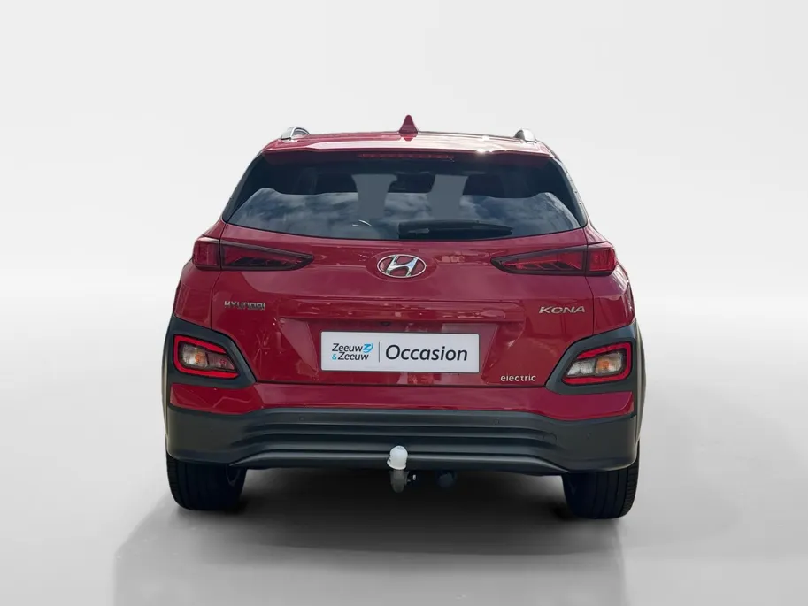 Hyundai Kona EV Fashion 64 kWh 204PK | Warmtepomp | SOH 100 % | Navigatie | Apple Carplay & Android Auto | Adaptive cruise control | Climate control | Head-up display | Parkeersensoren achter | Trekhaak |