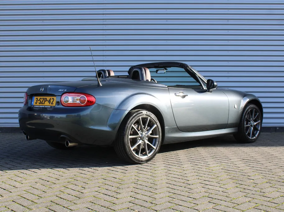Mazda MX-5 Roadster Coupé 1.8 Hanabi | Stoelverwarming | Leer | Navi | 17" LM | Cruise | Clima | Hardtop | Nieuwstaat | Ned. auto |