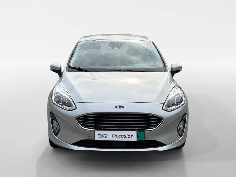 Ford Fiesta 1.0 EcoBoost Titanium | 1e Eigenaar | NL-Auto | Nieuwe distributieriem | Camera | Adaptive Cruisecontrol | Voorruitverwarming | B&O Audio | Navigatie | Apple Carplay&Android Auto | Climate Control | Dealer onderhouden |