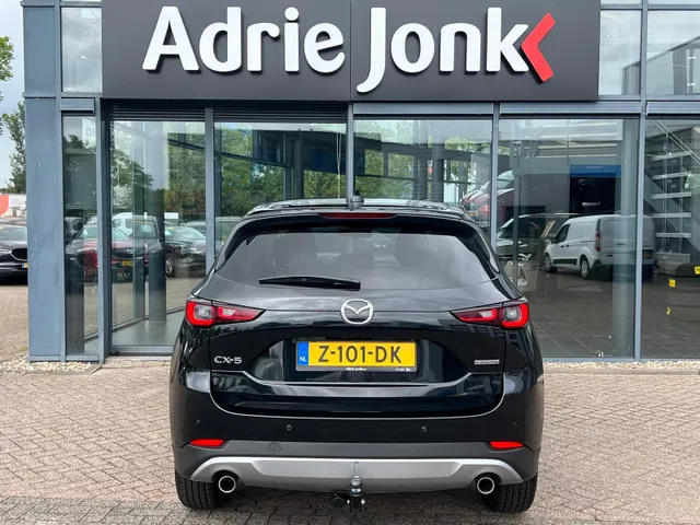 Mazda CX-5 2.0 e-SkyActiv-G M Hybrid 165 Newground AUTOMAAT | TREKHAAK | 360gr. CAMERA | NAVIGATIE | APPLE + ANDROID | HEAD-UP DISPLAY | 19'LM VELGEN | EL.A. KLEP |