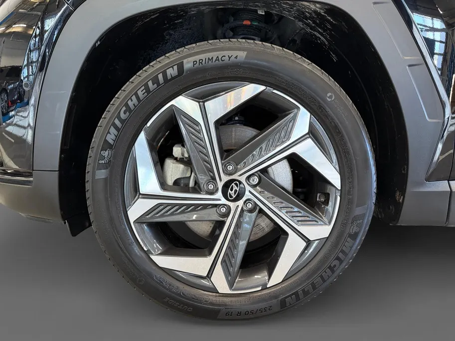 Hyundai Tucson 1.6 T-GDI PHEV Premium Sky 4WD | 66km WLTP elektrisch | Navigatie | Adaptive cruise control | Trekhaak | Apple Carplay & Android Auto | Dode hoek detectie | Draadloze telefoonlader |