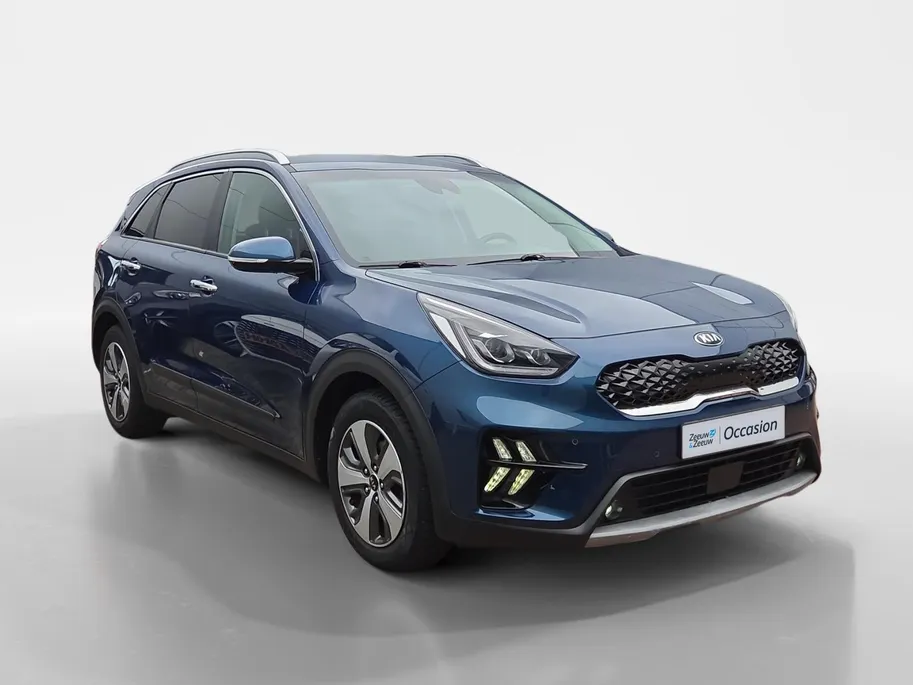 Kia Niro 1.6i Hybrid DynamicPlusLine Dealer onderhouden | Trekhaak | Stoel/stuurverwarming | Dodehoek detectie | Leder | Camera | Carplay & Android | Cruise Control Adaptief | Fabrieksgarantie t/m 23-9-2027 | NAP