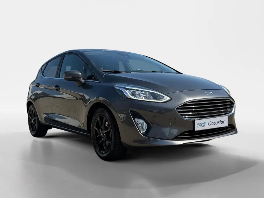 Ford Fiesta 1.0 EcoBoost Titanium | Dealer onderhouden | Winter pack | Parkeersensor achter | Apple carplay & Android auto | Navigatie via carplay | Cruise control | Elektr. inklapbare buitenspiegel | Privacy glas |