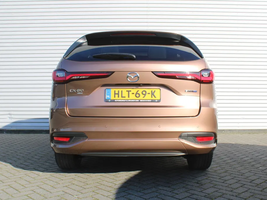 Mazda CX-80 2.5 e-SkyActiv PHEV Homura Plus | Trekhaak | Stuur-/stoelverwarming + ventilatie | 360 Camera | Schuifdak | Elek. stoelverst. | 20' LM | Leer | 7-zits |