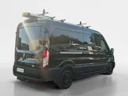 Ford Transit 350 2.0 TDCI L3H2 Trail 165 pk handgeschakeld | BPM VRIJ | Adaptive Cruise control | Navigatiesysteem | Raptor Gril | Zwarte treeplanken | LM velgen gloss black | Houten kasten links en rechts | Dakdragers met laddersysteem
