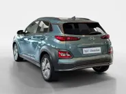 Hyundai Kona EV Fashion 64 kWh 204PK | Warmtepomp | Navigatie | Apple Carplay & Android Auto | 100% SOH | Adaptive cruise control | Climate control | Head-up display | Parkeersensoren achter |