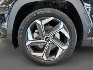 Hyundai Tucson 1.6 T-GDI PHEV Premium Sky 4WD | 66km WLTP elektrisch | Navigatie | Adaptive cruise control | Trekhaak | Apple Carplay & Android Auto | Dode hoek detectie | Draadloze telefoonlader |