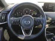 Mazda CX-80 2.5 e-SkyActiv PHEV Homura Plus | Trekhaak | Stuur-/stoelverwarming + ventilatie | 360 Camera | Schuifdak | Elek. stoelverst. | 20' LM | Leer | 7-zits |