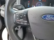 Ford Transit 350 2.0 TDCI L3H2 Trail 165 pk handgeschakeld | BPM VRIJ | Adaptive Cruise control | Navigatiesysteem | Raptor Gril | Zwarte treeplanken | LM velgen gloss black | Houten kasten links en rechts | Dakdragers met laddersysteem