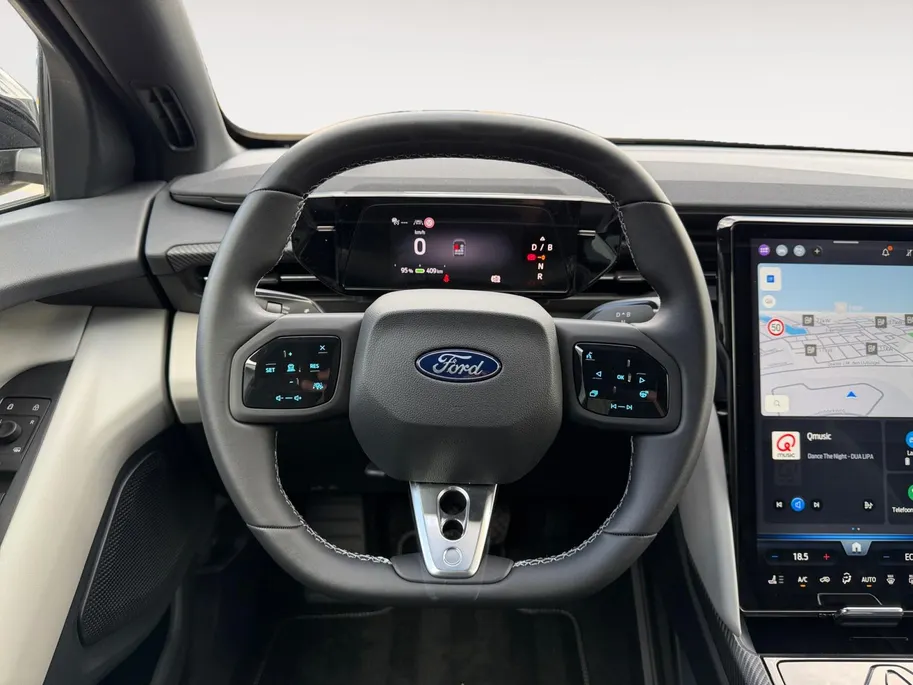 Ford Capri Premium Standard Range RWD 52 kWh | Uit Voorraad Leverbaar | €3.500,- Ready Set Ford Bonus | 374km WLTP Rijbereik | Warmtepomp | Draadloze Apple Carplay & Android Auto | B&O Premium Audio | Verwarmbare Voorstoelen | Adaptieve Cruise Control