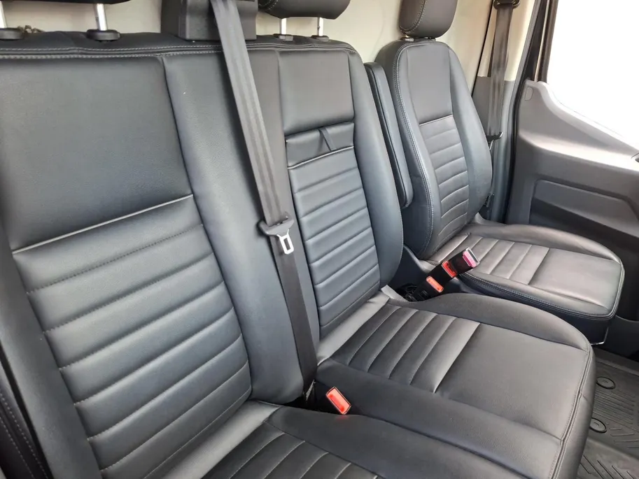 Ford Transit 350 2.0 TDCI L3H2 Trail 165 pk handgeschakeld | BPM VRIJ | Adaptive Cruise control | Navigatiesysteem | Raptor Gril | Zwarte treeplanken | LM velgen gloss black | Houten kasten links en rechts | Dakdragers met laddersysteem