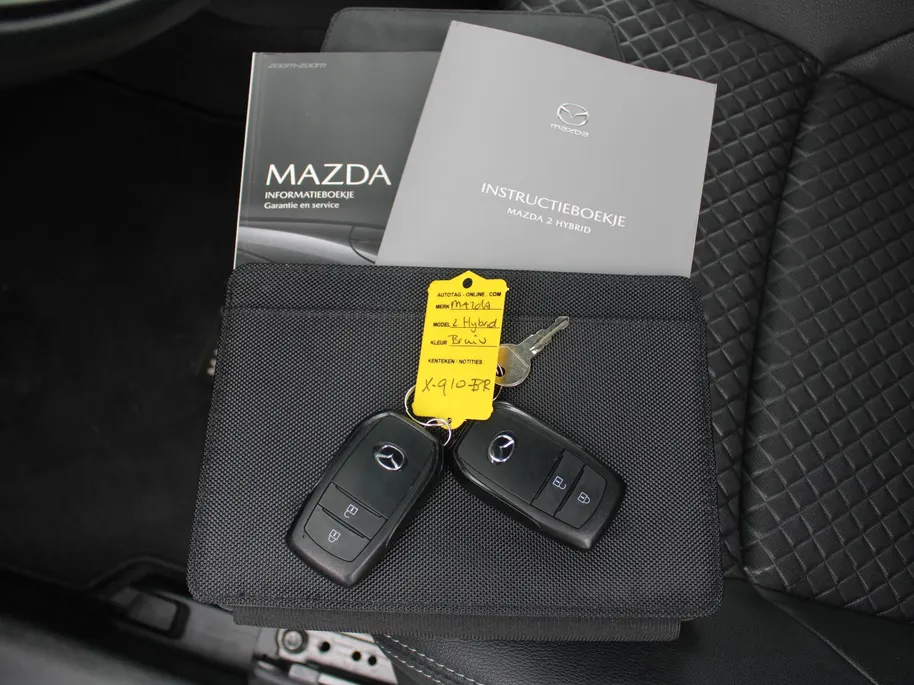 Mazda 2 Hybrid 1.5 Agile | Comfort pakket | Trekhaak | CarPlay | Camera | Stuur-/stoelverwarming | Cruise adapt. | 15' LM |