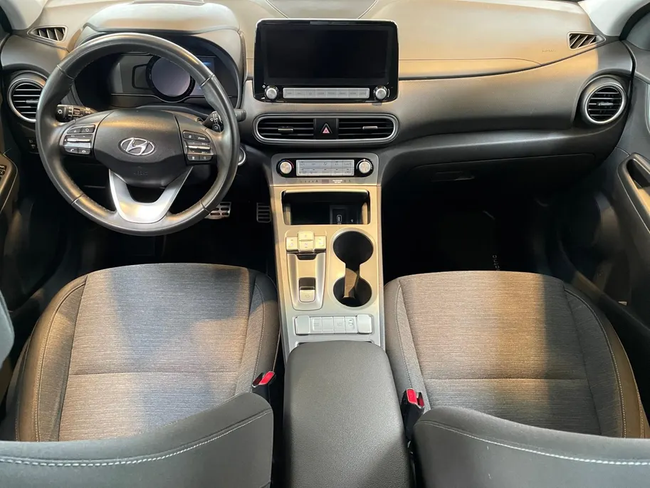Hyundai Kona EV Fashion 64 kWh 204PK | Warmtepomp | Navigatie | Apple Carplay & Android Auto | 100% SOH | Adaptive cruise control | Climate control | Head-up display | Parkeersensoren achter |