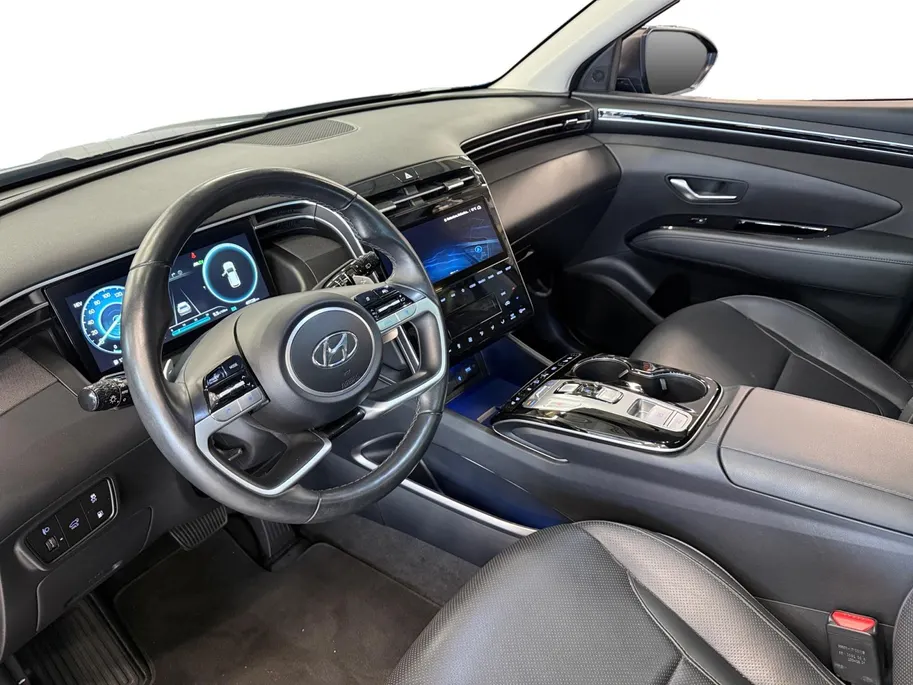 Hyundai Tucson 1.6 T-GDI PHEV Premium Sky 4WD | 66km WLTP elektrisch | Navigatie | Adaptive cruise control | Trekhaak | Apple Carplay & Android Auto | Dode hoek detectie | Draadloze telefoonlader |