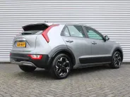 Kia Niro EV Light Edition 64.8 kWh | Airco | Cruise | Navi | Camera | PDC | 17' LM | All season banden | 17% bijtelling |