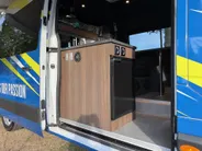 Renault Master T35 2.3 dCi 135 L3H2 Work Edition | Camper Edition | Motorsport Edition | Thule Omnistor Luifel | Airco in Leefruimte | TV | Koelkast | Magnetron | Volledig Bed | 2 Lederen Stoelen | DAB | LED Verlichting Leefruimte |