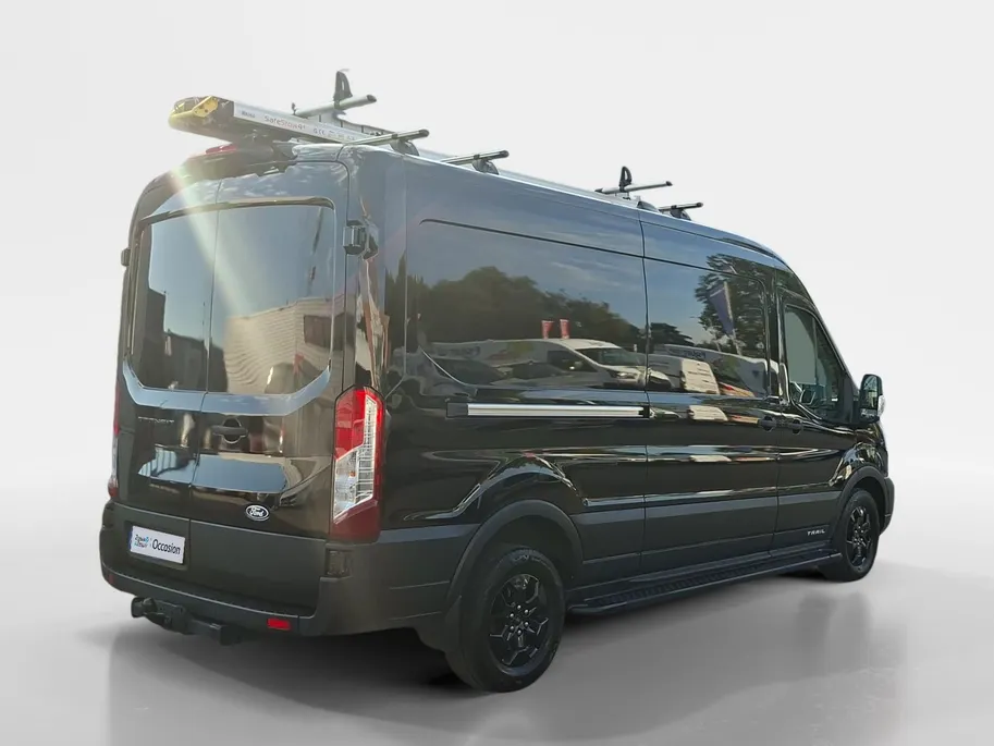 Ford Transit 350 2.0 TDCI L3H2 Trail 165 pk handgeschakeld | BPM VRIJ | Adaptive Cruise control | Navigatiesysteem | Raptor Gril | Zwarte treeplanken | LM velgen gloss black | Houten kasten links en rechts | Dakdragers met laddersysteem