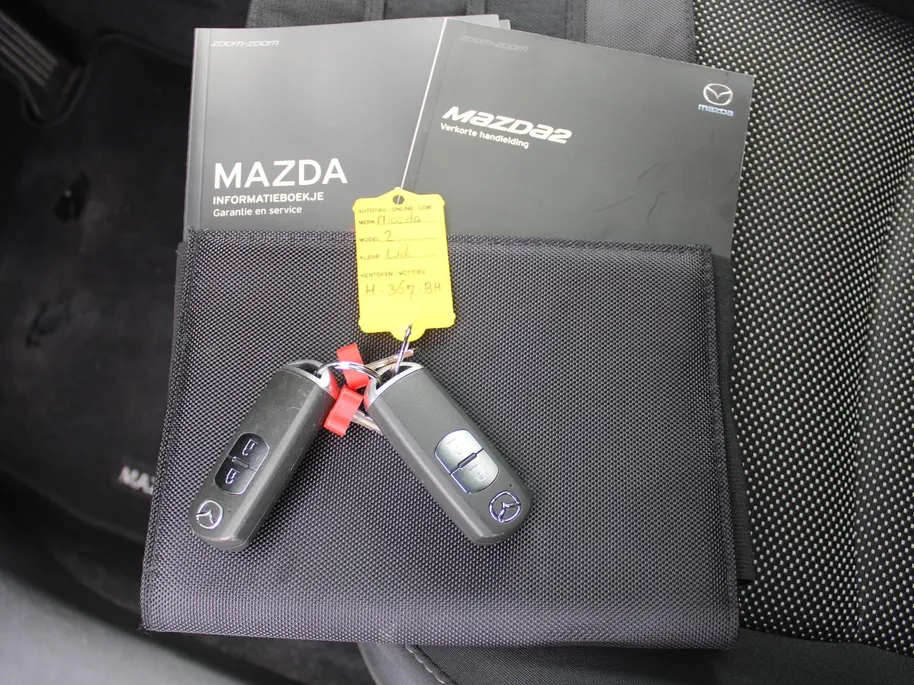 Mazda 2 1.5 Skyactiv-G GT-M | Trekhaak | Camera | Stoelverwarming | 16' LM | Navi | Cruise | Clima | Dodehoek detectie | LED | HUD |