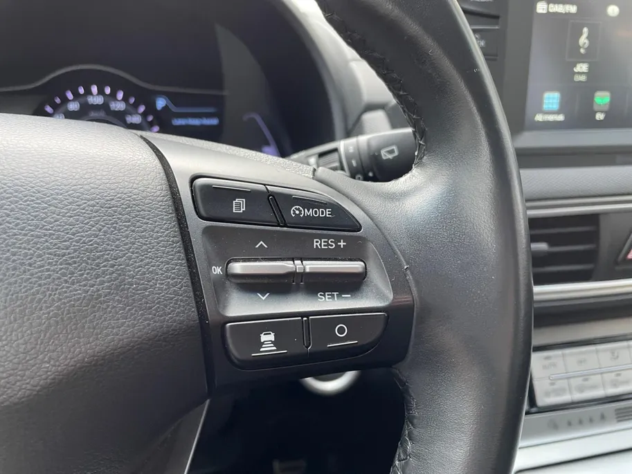 Hyundai Kona EV Comfort 64 kWh | Warmtepomp | 100% SOH | Adaptive cruise control | Apple Carplay & Android Auto | Achteruitrijcamera | Parkeersensoren achter | Keyless entry | DAB radio |