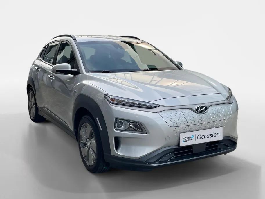Hyundai Kona EV Comfort 64 kWh 204PK | Warmtepomp | 100% SOH | Adaptive cruise control | Apple Carplay & Android Auto | Achteruitrijcamera | Parkeersensoren achter | Keyless entry | DAB radio |