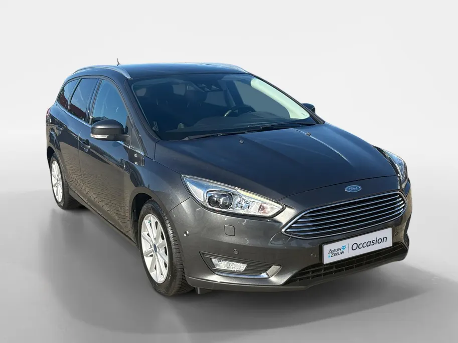 Ford Focus Wagon 1.0 Titanium |Lederen/stof bekleding| Trekhaak| bi-xenon koplampen| keyless entry| 12 maanden Bovag garantie|
