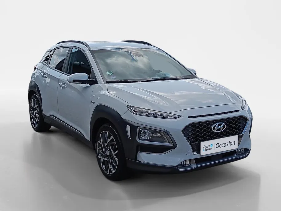 Hyundai Kona 1.6 GDI HEV Premium | Trekhaak | Apple Carplay/Android Auto | Adaptive cruise control | Dodenhoek herkenning | Leren bekleding