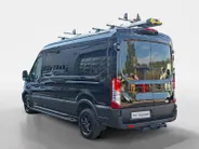 Ford Transit 350 2.0 TDCI L3H2 Trail 165 pk handgeschakeld | BPM VRIJ | Adaptive Cruise control | Navigatiesysteem | Raptor Gril | Zwarte treeplanken | LM velgen gloss black | Houten kasten links en rechts | Dakdragers met laddersysteem